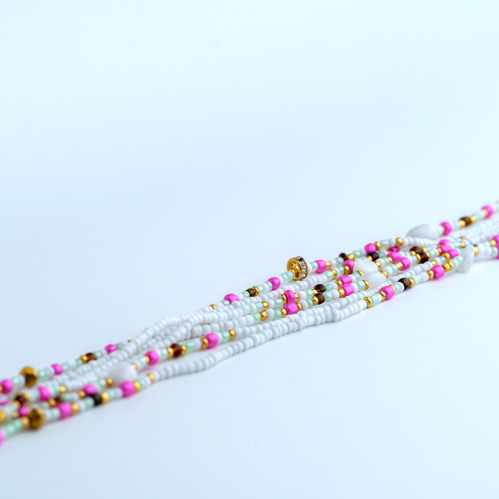 White with green pink gold and gold gems and smooth milky stones waist beads with clasp. 