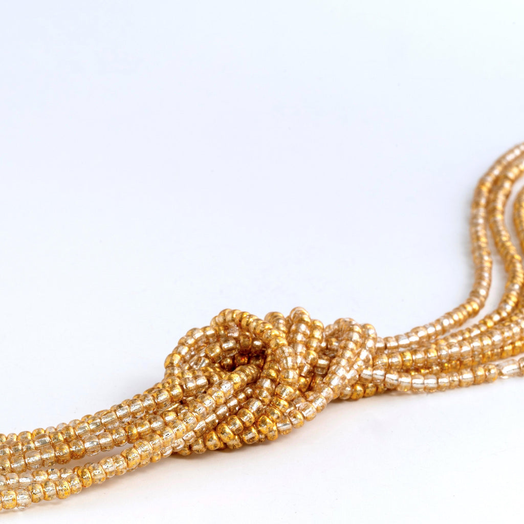 Transparent gold waist beads with clasp. 